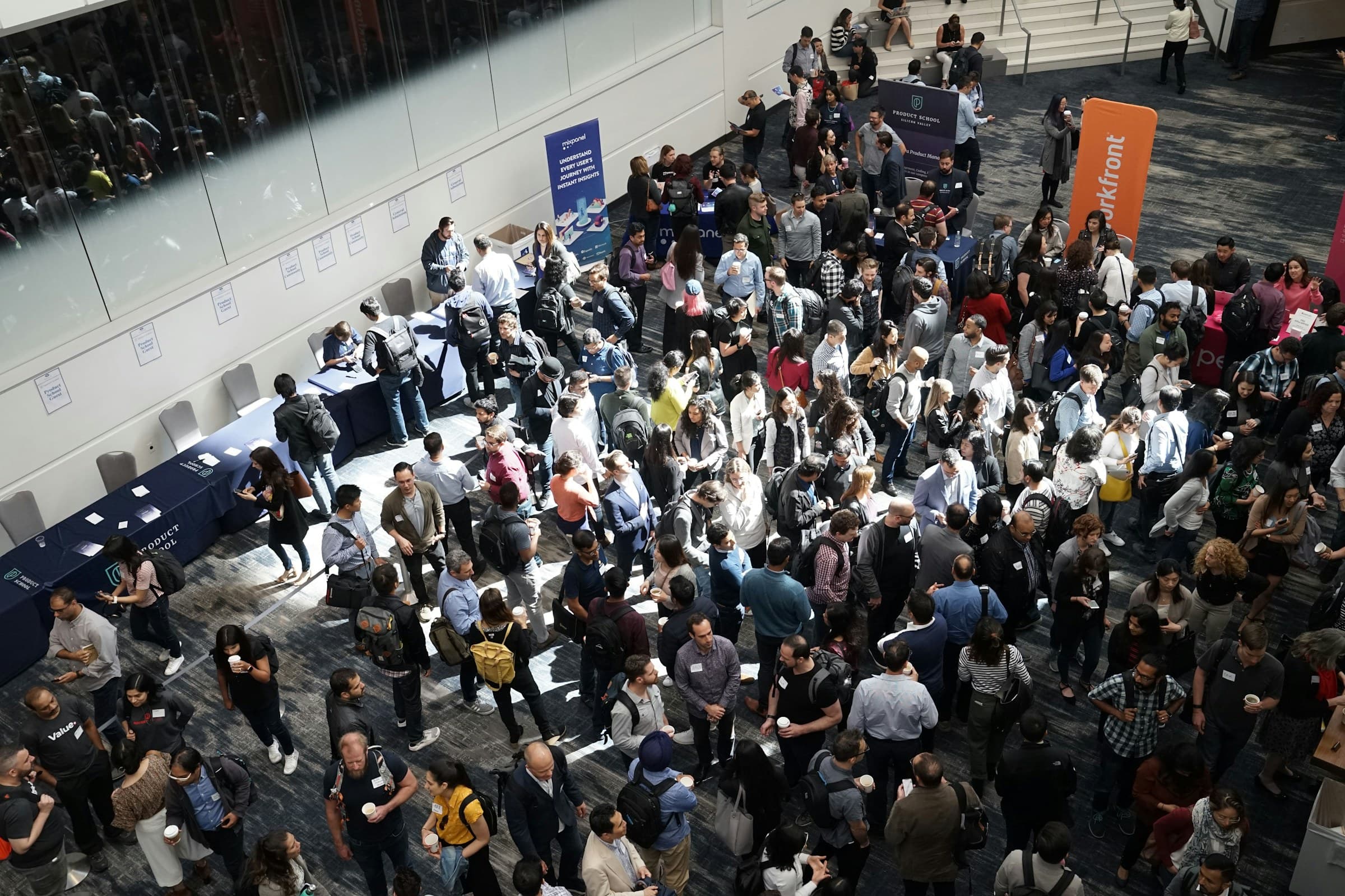 Guests networking in a conference foyer